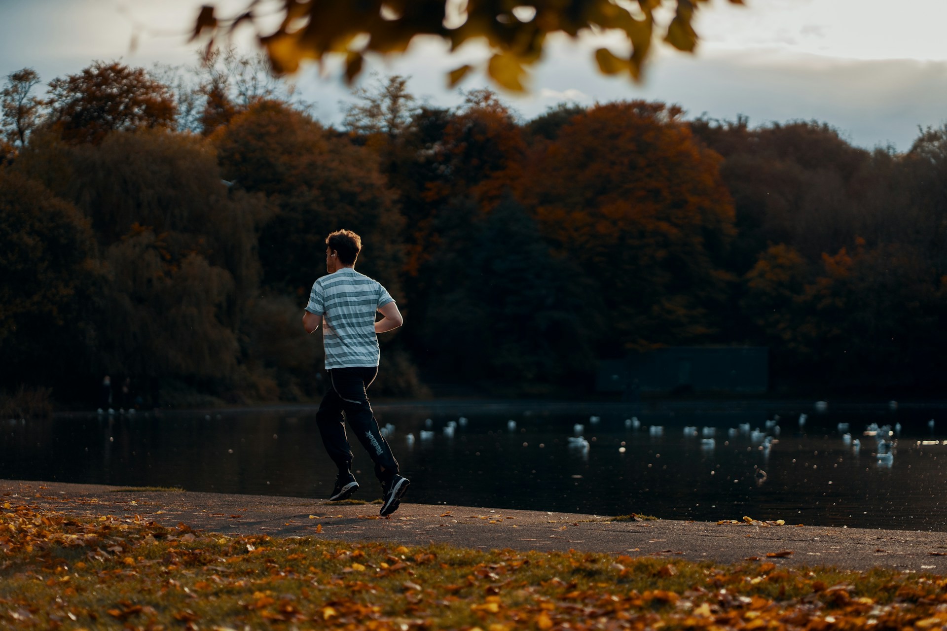 A person running in Queens Park, Glasgow.